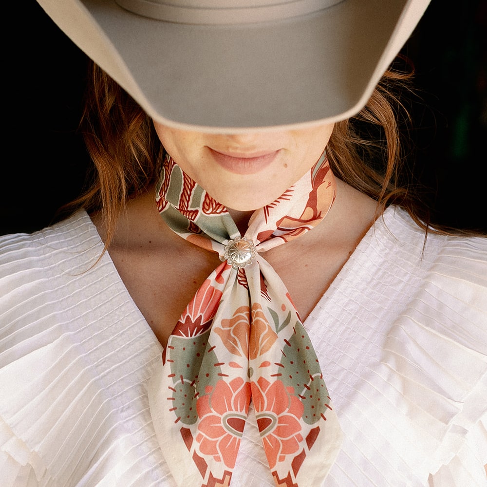 a woman wearing a Shop Marian Concho Queen Scarf Slide.