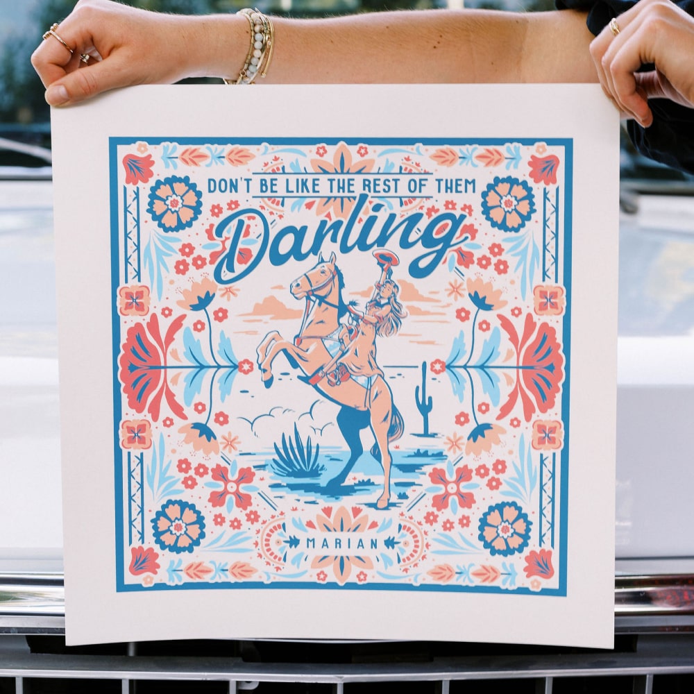a person holding up a poster that says the best of the Darling Print by Shop Marian.