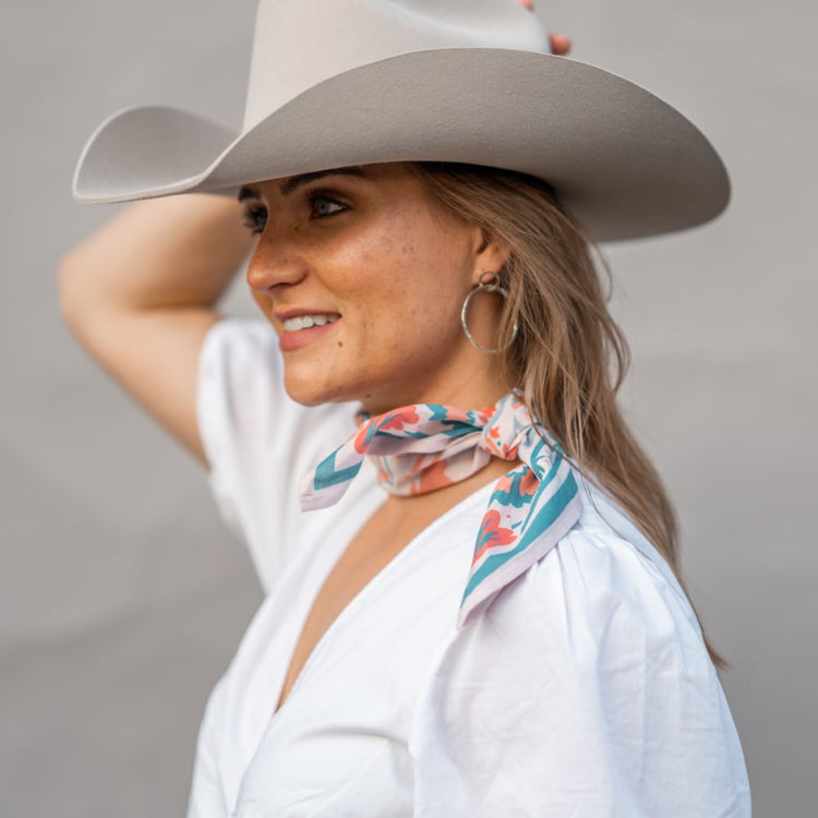 a woman wearing a Shop Marian cowboy hat and Darling Scarf.