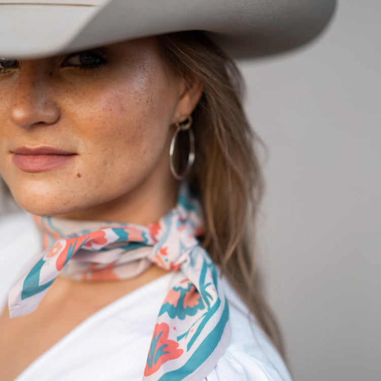 a woman wearing a cowboy hat and Darling Scarf by Shop Marian.